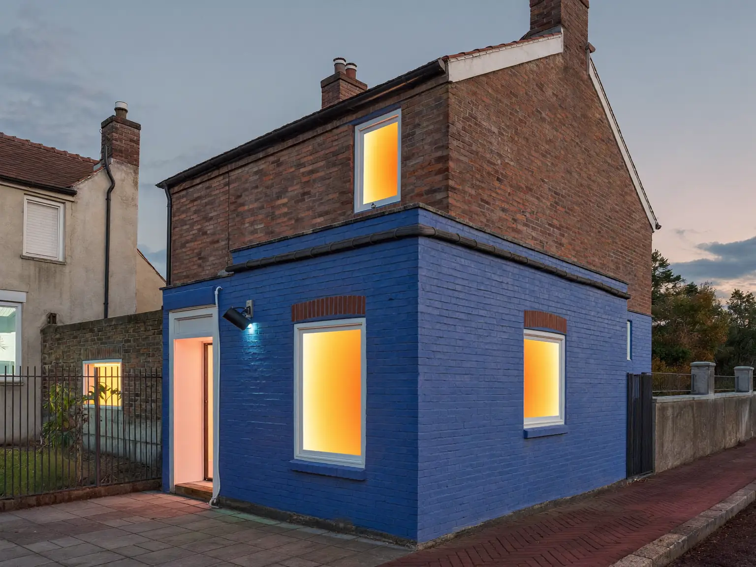 Thermal-style view of a UK house showing heat loss at the windows